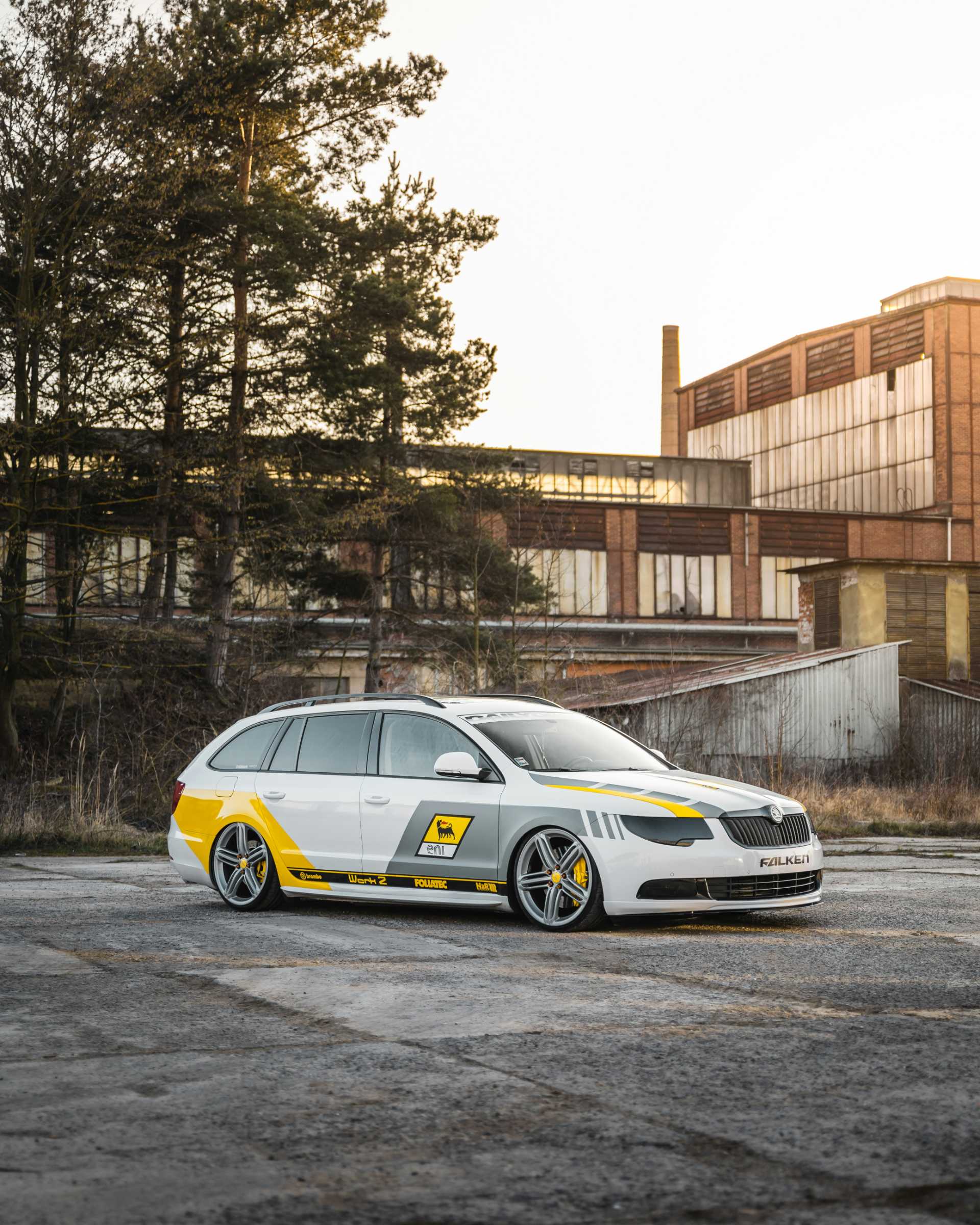 Custom white and yellow car parked outdoors